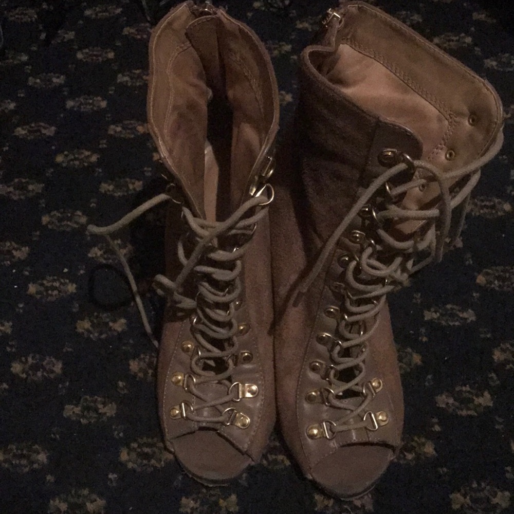 Lace up, peep toe, high heel shoes.